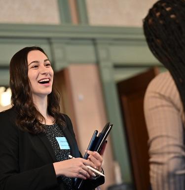 A student talks to a representative at the Pitt career fair